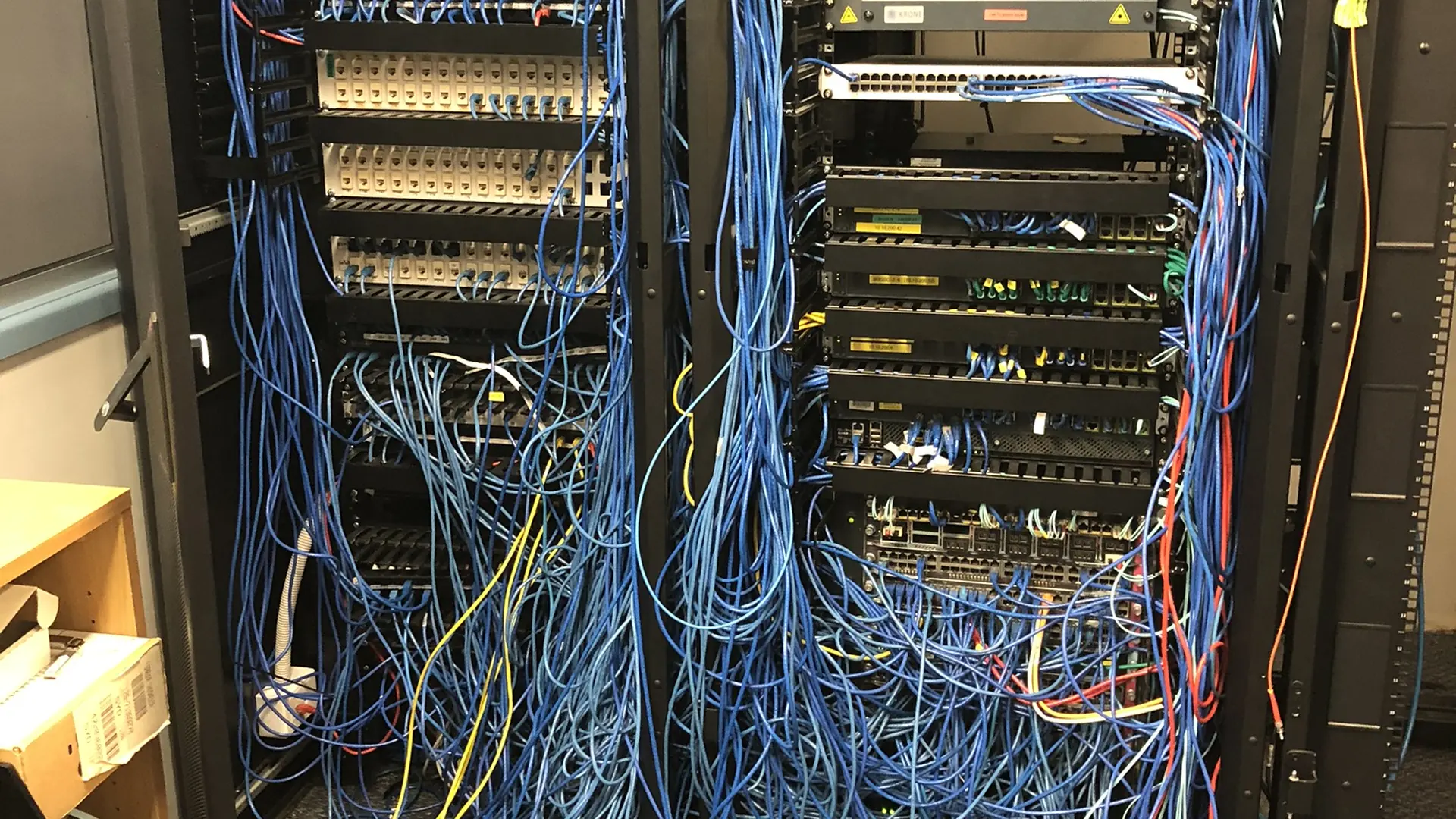 Communications rack before maintenance remediation