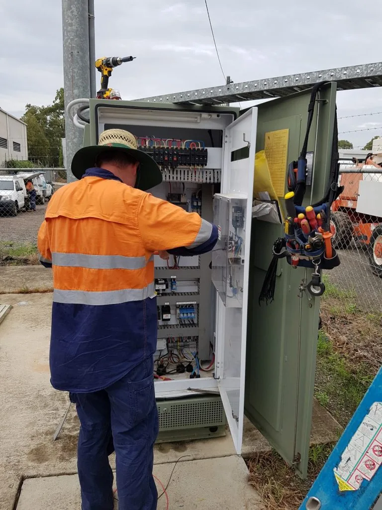 EDC Systems technician repairing an electrical cabinet